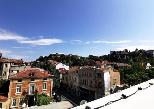 a view of a city with buildings on a hill at Rare view in Plovdiv