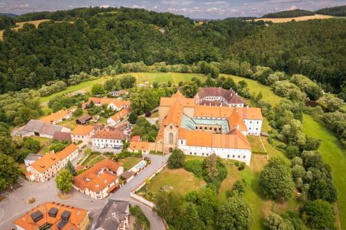 an aerial view of a large house with orange roofs at Penzion a kemp Koruna in Zlatá Koruna