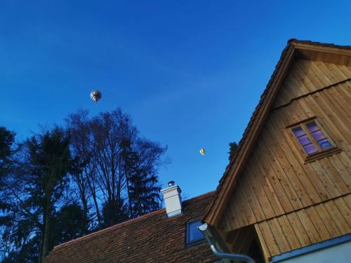 a house with a bird on the roof at Ferienhaus Grabenhansl in Stubenberg