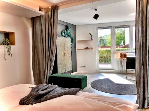 a bedroom with a bed and a window at Sweet Home Tholey in Tholey