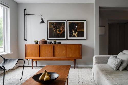 a living room with a couch and a table at Prestigious in Prahran by Ready Set Stay in Melbourne