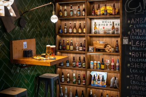 a bar with bottles of alcohol on the wall at Climia Belroy 4 Sup in Benidorm