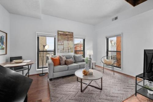 a living room with a couch and a table at Stylish Mt Adams 1BR in great location in Cincinnati