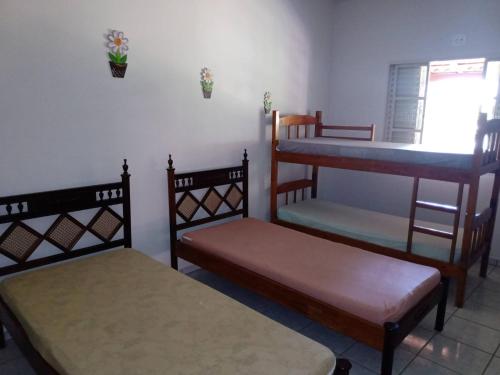 Ένα ή περισσότερα κρεβάτια σε δωμάτιο στο Rancho Rio Dourado, um paraíso!