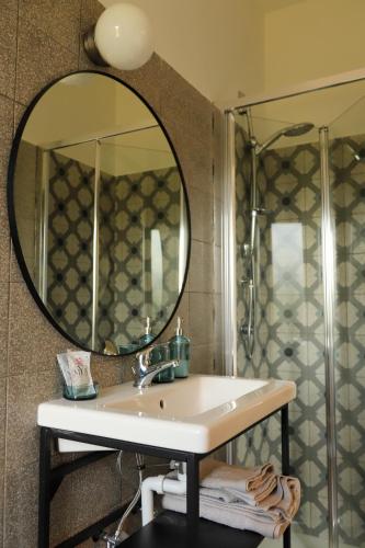 a bathroom with a sink and a mirror at Azienda Agricola Sebastiani in Cittaducale