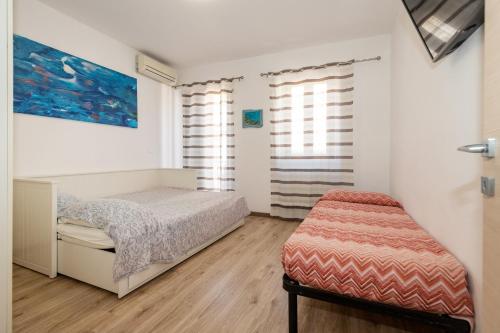 Postel nebo postele na pokoji v ubytování Mazzeo beach house 2