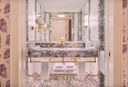 a bathroom with a sink and a mirror at Hotel Barrière Fouquet's New York in New York