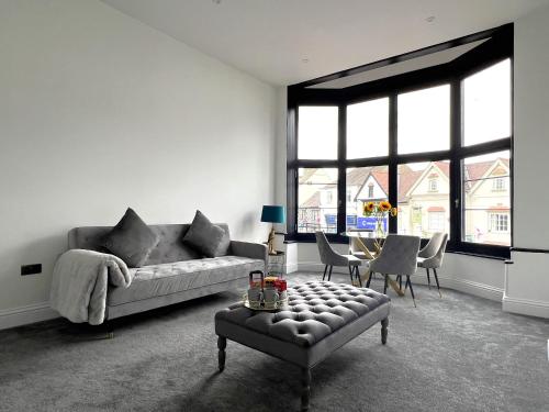 a living room with a couch and a table at Black Horse Apartments in Knaresborough