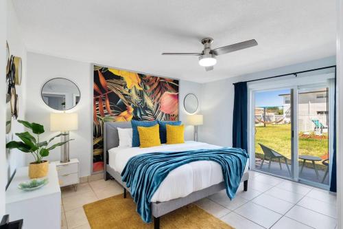a bedroom with a bed with a painting on the wall at Ocean 2 - Seaside boutique in Indian Harbour Beach