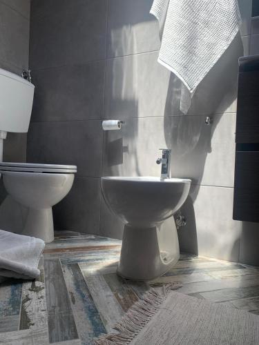 a bathroom with a toilet and a bidet at CD Romanello (Mura S. Cataldo) in Barletta