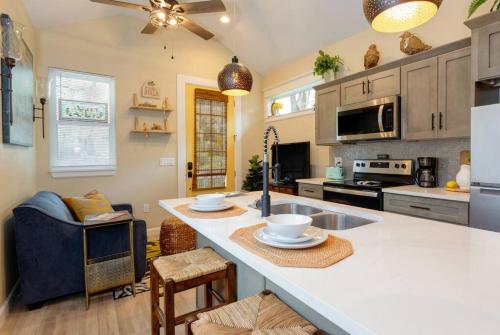 a kitchen with a large white island in a room at Downtown Tiny Life - Experience Tiny Living! in Orlando