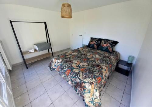 En eller flere senge i et værelse på Maison au calme à 10 km du Puy du Fou