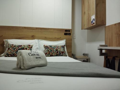 Postel nebo postele na pokoji v ubytování Hotel Park Caribe