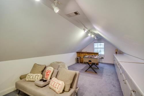 a living room with a couch and a table at Charming Diamondhead Home with Private Yard! in Diamondhead