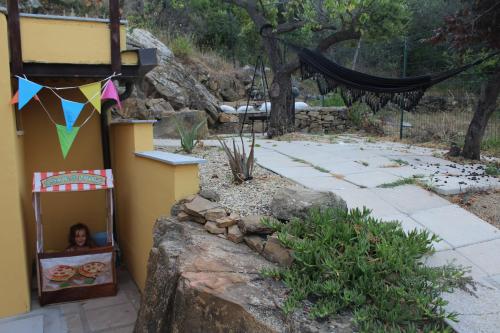 a child in a box in a house with a kite at Villa CliCla - Pool, sea,hommock swing and laziness in Imperia