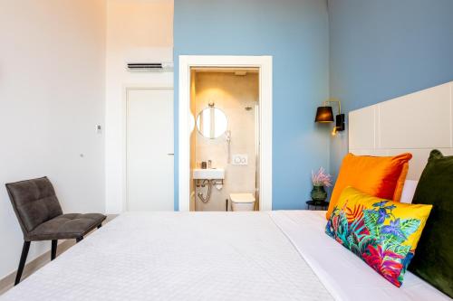 Postel nebo postele na pokoji v ubytování Magnini Rooms