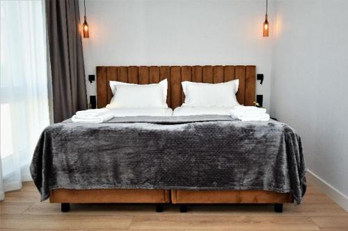 Postel nebo postele na pokoji v ubytování Patio Riverfront Aparthotel