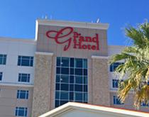 a large building with a sign on the side of it at The Grand Hotel at Coushatta in Kinder
