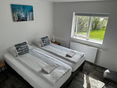 Un ou plusieurs lits dans un hébergement de l'établissement Guesthouse Dyngja