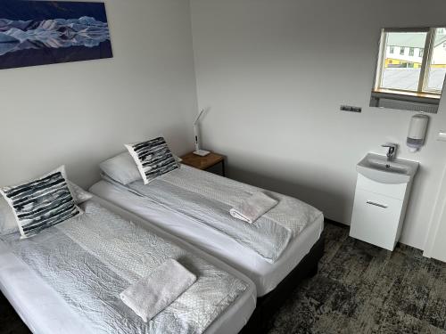 Un ou plusieurs lits dans un hébergement de l'établissement Guesthouse Dyngja