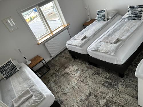 Un ou plusieurs lits dans un hébergement de l'établissement Guesthouse Dyngja