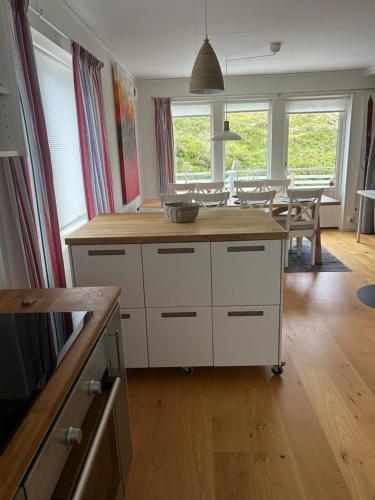 a kitchen with a island with a wooden counter top at Joängets Fjällgård 18a in Sälen