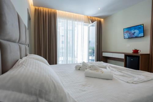 Una cama o camas en una habitación de Hotel Miami Beach