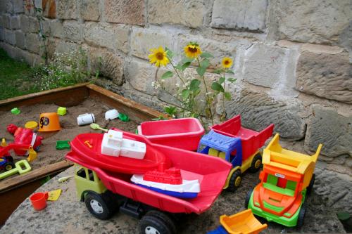 a pile of toys sitting next to a wall at Chalupa Branžež Komárovský rybník in Branžež
