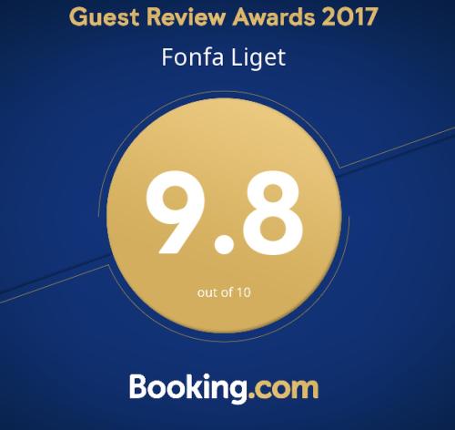 a yellow circle with the text guest review awards formula lighter at Fonfa Liget in Sénye