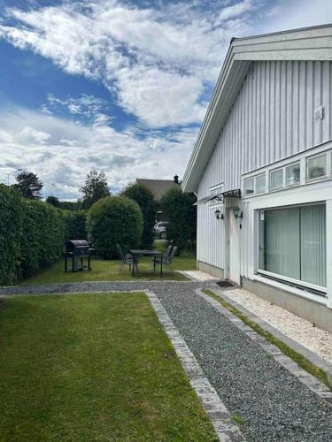 a house with a picnic table next to a building at Studiolägenhet i Höga Kusten in Ullanger