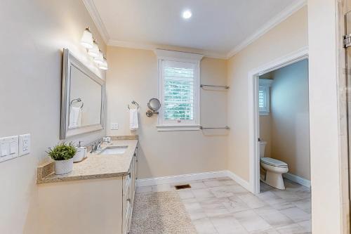 a bathroom with a sink and a toilet at Cape Castle in Mashpee