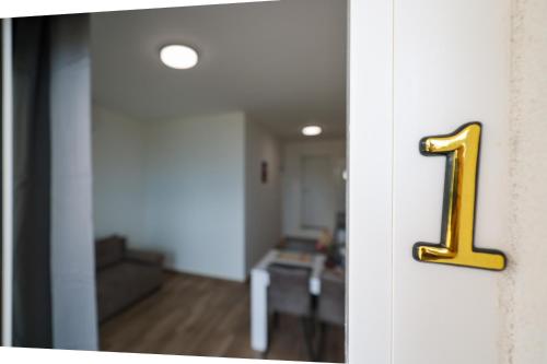 a door with a number one on it in a room at Beachfront Apartments Tić with Seaview in Miletići