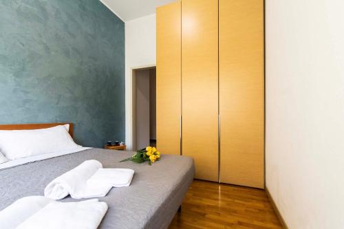 Een bed of bedden in een kamer bij Garibaldi - Exclusive Apartment