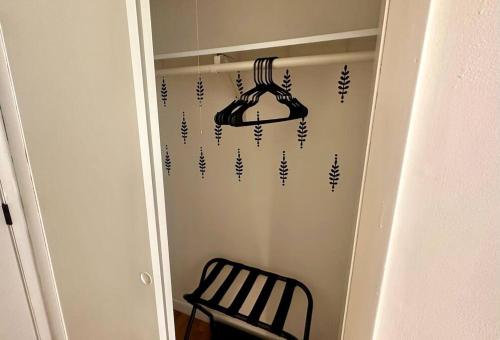 a closet with a hanger and a chair in a room at Mountain View Getaway - Stunning Views and Privacy in Shenandoah