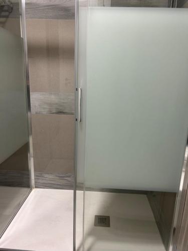 a sliding glass door in a room at ANMAN HHBB tourism & business rooms in Padova