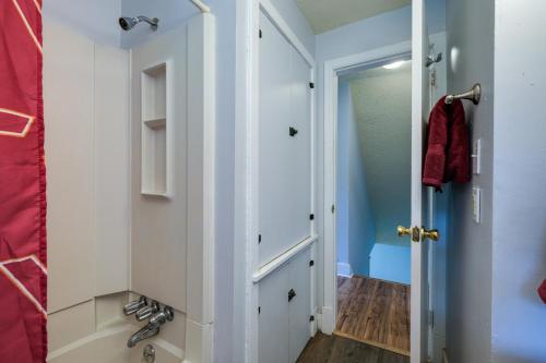 a bathroom with a shower and a sink and a door at Blacksburg Vacation Rental Near Virginia Tech! in Blacksburg