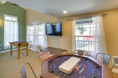 a room with a ping pong table and agamuitous at Coastal Lincoln City Home with Spacious Deck! in Lincoln City