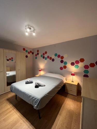 a bedroom with a bed with hearts on the wall at Maison villageoise in Anhée