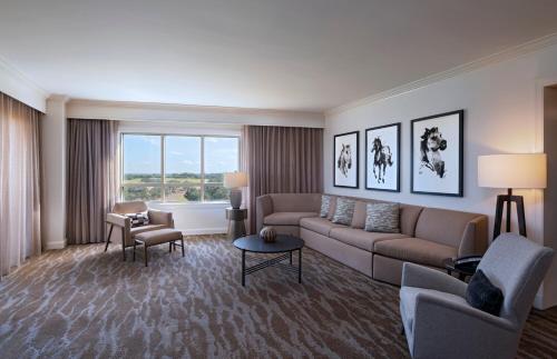 a living room with a couch and chairs and a window at JW Marriott San Antonio Hill Country Resort & Spa in San Antonio