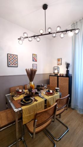 a dining room with a table and chairs at BauHaus - Sleepwithme - Free Parking - Free Braeakfast - Very Friendly Staff in Pisa