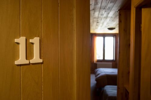 a door to a room with two beds on a train at Hostal Mundo Nuevo in Ancud