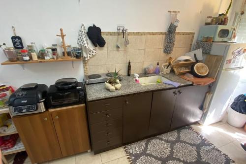 a kitchen with a sink and a counter top at Sea view apartment in Haifa
