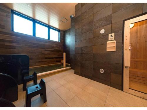 a waiting room with a door and a window at QUEEN'S HOTEL CHITOSE - Vacation STAY 67732v in Chitose