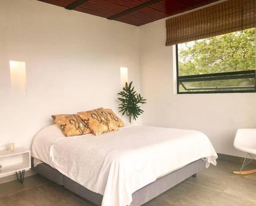 En eller flere senger på et rom på Casa en Chivor a 3 hrs de Bogota