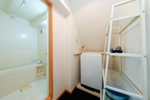 a small bathroom with a toilet and a ladder at Grace Heiwajima - Vacation STAY 15089 in Tokyo