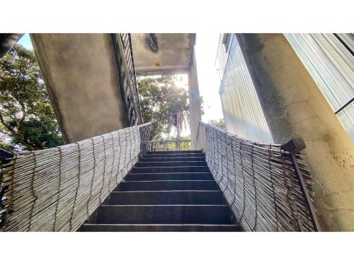 a stairway leading up to a building with a stair railing at Forte "Hachijojima" - Vacation STAY 62454v in Hachijo