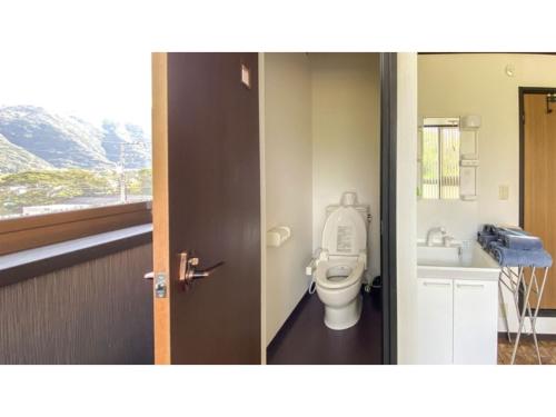 a bathroom with a toilet and a sink at Forte "Hachijojima" - Vacation STAY 62473v in Hachijo