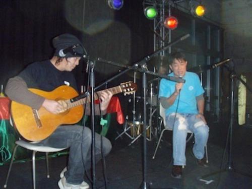 two men playing guitar and singing on a stage at Forte "Hachijojima" - Vacation STAY 62473v in Hachijo
