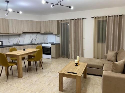 a living room and kitchen with a couch and a table at Maria’s Apartment in Monemvasia