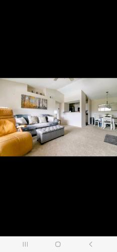 a large living room with two couches and a table at Mallard in Jacksonville